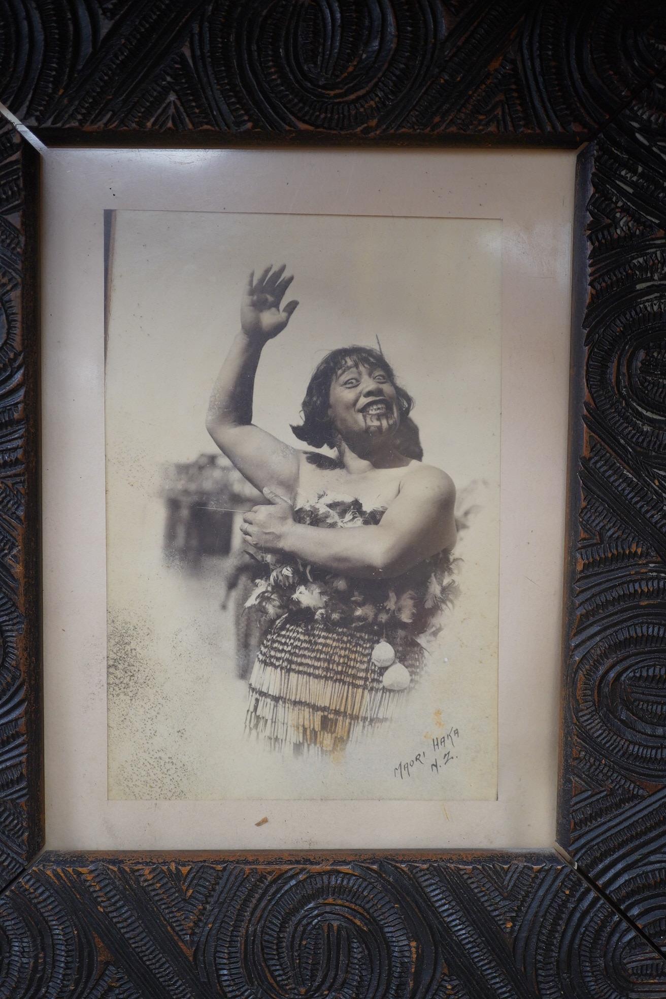 A pair of Maori carved wood photograph frames containing contemporary New Zealand photographs c.1900-10, carved in relief with rauponga lines and spirals, inset with contemporary albumen photos, depicting figures by Waik